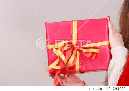 Woman with red christmas gift box Woman with red christmas gift box 134293052