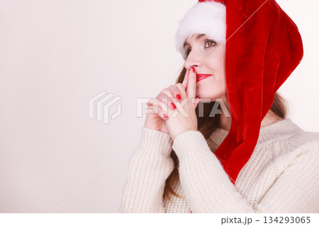 Woman wearing santa claus hat Woman wearing santa claus hat 134293065