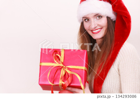 Woman holding gift box. Christmas time 134293086