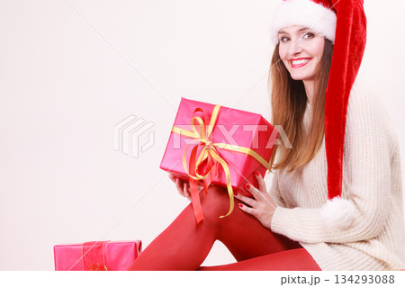 Woman holding gift box. Christmas time 134293088