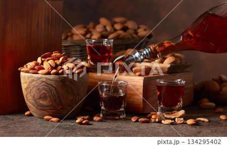 Italian liqueur Amaretto with almonds nuts. Italian liqueur Amaretto with almonds nuts. 134295402