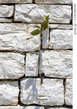 Stone wall and keys on a cord, Kerkyra, Corfu, Greece 134296008