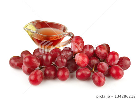 Red Grapes and Wine or Vinegar in Glass Gravy Boat 134296218