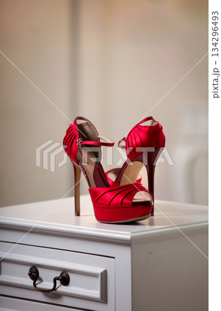 Elegant high heels woman shoes rest on an aesthetic background, good for creating a striking fashion still life perfect for beauty, footwear, or fashion retail campaigns 134296493