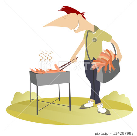 Smiling man preparing meal on fire. Cheerfulness young man frying sausages and steaks on the grill on the lawn 134297995