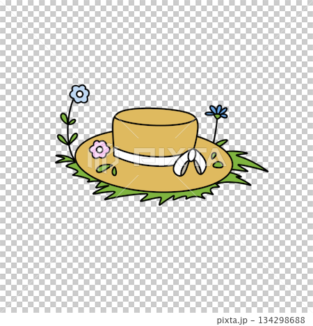 A yellow hat with flowers on it is sitting on the grass A yellow hat with flowers on it is sitting on the grass 134298688