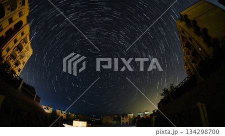 Star Trails Over Night Cityscape 134298700