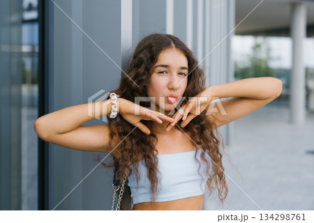 Trendy Teenager With Pouting Lips Outdoors Trendy Teenager With Pouting Lips Outdoors 134298761