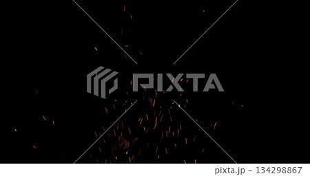 Realistic fire sparks flying through the air, isolated on a black background. Perfect as a cinematic VFX overlay, fire particles effect or visual element. 134298867
