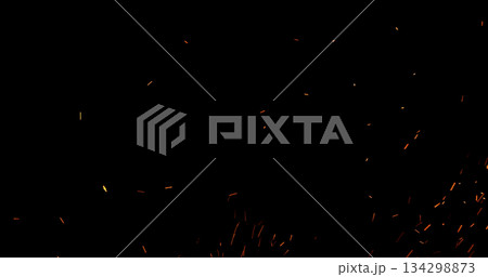 Realistic fire sparks flying through the air, isolated on a black background. Perfect as a cinematic VFX overlay, fire particles effect or visual element. Realistic fire sparks flying through the air, isolated on a black background. Perfect as a cinematic VFX overlay, fire particles effect or visual element. 134298873