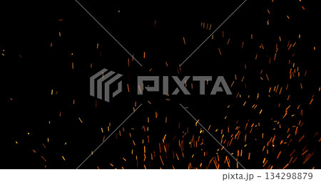 Realistic fire sparks flying through the air, isolated on a black background. Perfect as a cinematic VFX overlay, fire particles effect or visual element. Realistic fire sparks flying through the air, isolated on a black background. Perfect as a cinematic VFX overlay, fire particles effect or visual element. 134298879