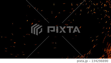 Realistic fire sparks flying through the air, isolated on a black background. Perfect as a cinematic VFX overlay, fire particles effect or visual element. Realistic fire sparks flying through the air, isolated on a black background. Perfect as a cinematic VFX overlay, fire particles effect or visual element. 134298890