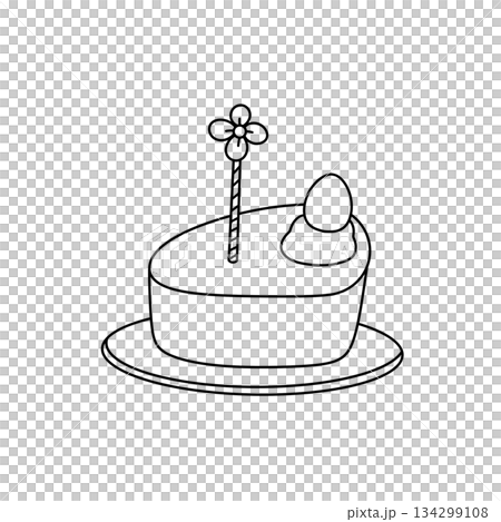A cake with a flower on top and an egg on the side 134299108