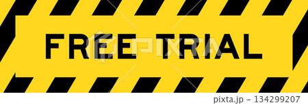 Yellow and black color with line striped label banner with word free trial Yellow and black color with line striped label banner with word free trial 134299207