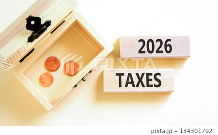2026 taxes new year symbol. Concept words 2026 taxes on beautiful wooden blocks. Beautiful white paper background. Beautiful wooden chest with coins. Business 2026 taxes new year concept. Copy space. 2026 taxes new year symbol. Concept words 2026 taxes on beautiful wooden blocks. Beautiful white paper background. Beautiful wooden chest with coins. Business 2026 taxes new year concept. Copy space. 134301792