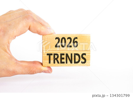 2026 Trends new year symbol. Concept words 2026 Trends on beautiful wooden blocks. Beautiful white paper background. Businessman's hand. Business and 2026 Trends new year concept. Copy space. 134301799
