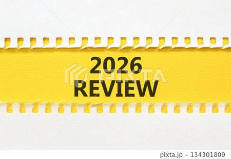 2026 Review symbol. Concept words 2026 Review on beautiful yellow paper. Beautiful white paper background. Business and 2026 review concept. Copy space. 2026 Review symbol. Concept words 2026 Review on beautiful yellow paper. Beautiful white paper background. Business and 2026 review concept. Copy space. 134301809