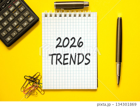 2026 Trends new year symbol. Concept words 2026 Trends on beautiful white note. Beautiful yellow background. Black pen. Beautiful black calculator. Business 2026 Trends new year concept. Copy space. 134301869