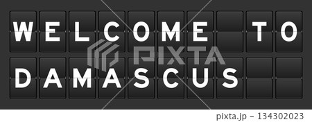 Black color analog flip board with word welcome to damascus on gray background Black color analog flip board with word welcome to damascus on gray background 134302023