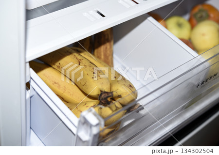 Ripe fruits in the refrigerator compartment. Fruits are in the fridge. Ripe fruits in the refrigerator compartment. Fruits are in the fridge. 134302504