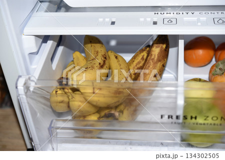 Ripe fruits in the refrigerator compartment. Fruits are in the fridge. Ripe fruits in the refrigerator compartment. Fruits are in the fridge. 134302505