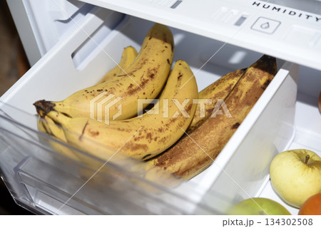 Ripe fruits in the refrigerator compartment. Fruits are in the fridge. 134302508