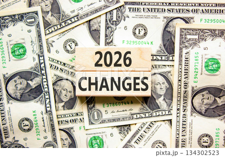2026 Changes symbol. Concept words 2026 Changes on beautiful wooden blocks. Beautiful dollar bills background. Dollar bills. Business and 2026 changes concept. Copy space. 134302523