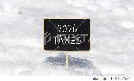 2026 taxes new year symbol. Concept words 2026 taxes on beautiful black blackboard. Beautiful white snow background. Business and 2026 taxes new year concept. Copy space. 2026 taxes new year symbol. Concept words 2026 taxes on beautiful black blackboard. Beautiful white snow background. Business and 2026 taxes new year concept. Copy space. 134302566