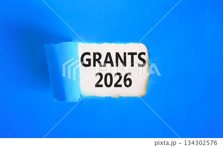 Grants 2026 symbol. Concept words Grants 2026 on beautiful white paper. Beautiful blue paper background. Business and grants 2026 concept. Copy space. 134302576