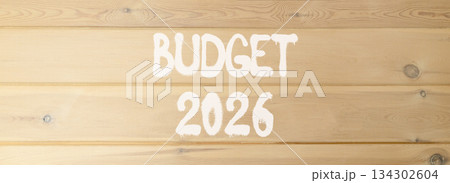 Budget 2026 symbol. Concept words Budget 2026 on beautiful wooden wall. Beautiful wooden wall background. Business and budget 2026 concept. Copy space. 134302604