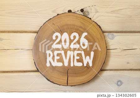 2026 Review symbol. Concept words 2026 Review on beautiful wooden circle. Beautiful wooden wall background. Business and 2026 review concept. Copy space. 134302605