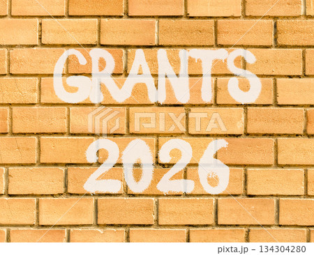 Grants 2026 symbol. Concept words Grants 2026 on beautiful old brown brick wall. Beautiful old brown brick wall background. Business and grants 2026 concept. Copy space. 134304280