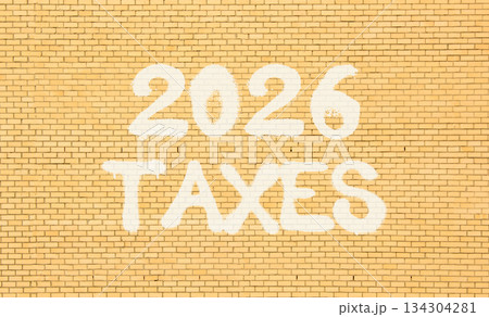 2026 taxes new year symbol. Concept words 2026 taxes on beautiful old brown brick wall. Beautiful old brown brick wall background. Business and 2026 taxes new year concept. Copy space. 134304281