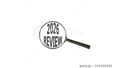 2026 Review symbol. Concept words 2026 Review on beautiful white paper. Black magnifying glass. Beautiful white paper background. Business and 2026 review concept. Copy space. 134304285