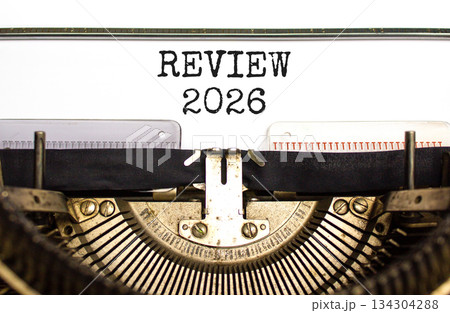 Review 2026 symbol. Concept words Review 2026 typed on beautiful old retro typewriter. Beautiful white paper background. Beautiful old typewriter. Business and review 2026 concept. Copy space. 134304288