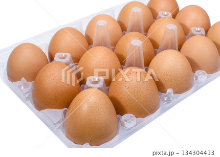 Brown chicken eggs in a plastic tray Brown chicken eggs in a plastic tray 134304413