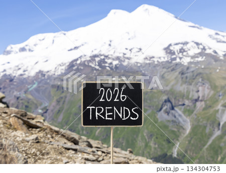 2026 Trends new year symbol. Concept words 2026 Trends on beautiful black blackboard. Beautiful mountain Elbrus and blue sky background. Business and 2026 Trends new year concept. Copy space. 134304753