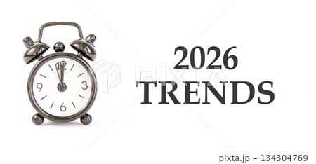 2026 Trends new year symbol. Concept words 2026 Trends on beautiful white paper. Beautiful white paper background. Beautiful black alarm clock. Business and 2026 Trends new year concept. Copy space. 134304769