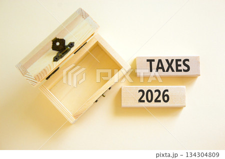 Taxes 2026 new year symbol. Concept words Taxes 2026 on beautiful wooden blocks. Beautiful white paper background. Beautiful empty wooden chest. Business and taxes 2026 new year concept. Copy space. Taxes 2026 new year symbol. Concept words Taxes 2026 on beautiful wooden blocks. Beautiful white paper background. Beautiful empty wooden chest. Business and taxes 2026 new year concept. Copy space. 134304809