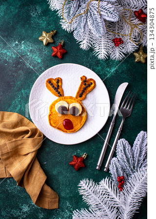 Pancakes in the shape of Santa reindeer 134304875