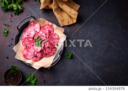 Sliced spicy tasty salami sausage 134304876