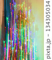 Conceptual shot of the decorated Christmas tree in the apartment, where lights from garlands as a trails 134305034