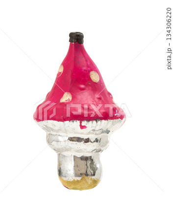 Vintage glass Christmas ornament: red mushroom with white spots, reflective silver gold stem, isolated on white. Vintage glass Christmas ornament: red mushroom with white spots, reflective silver gold stem, isolated on white. 134306220