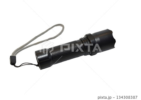 Black flashlight powered by AA batteries. 134308387
