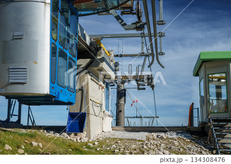 Cable car for suspended chairlifts in the Austrian Alps against the sky in early autumn. Cable car for suspended chairlifts in the Austrian Alps against the sky in early autumn. 134308476