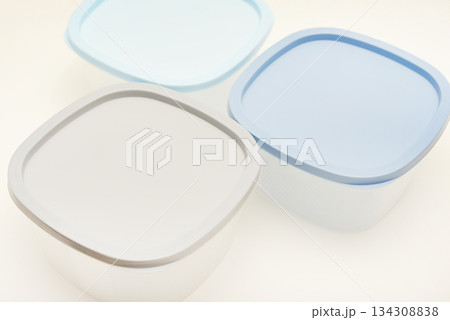 Large containers for food. Three plastic containers with a blue lid for food on a white background. Large containers for food. Three plastic containers with a blue lid for food on a white background. 134308838