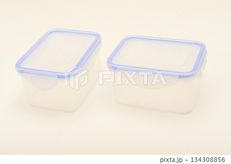 Small containers for food. Two plastic containers with a blue lid for food on a white background. Small containers for food. Two plastic containers with a blue lid for food on a white background. 134308856