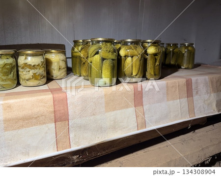 Pickled cucumbers in glass jar 134308904