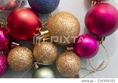 Colorful Christmas ornaments close-up, festive and vibrant holiday decoration, top view Colorful Christmas ornaments close-up, festive and vibrant holiday decoration, top view 134309185