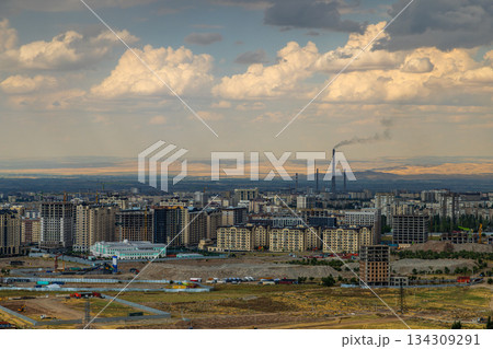 Cityscape of Bishkek at summer day with construction of new high-rise residential buildings. Cityscape of Bishkek at summer day with construction of new high-rise residential buildings. 134309291